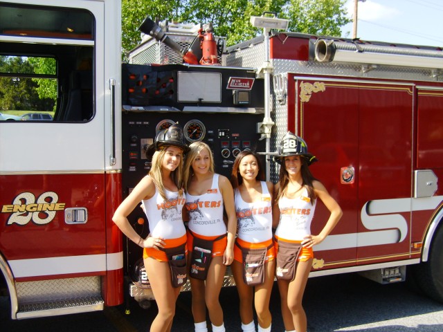 Parkesburg Fire Company takes on a whole new look........in Ford's dreams! The girls from Hooters pose for a shot during a visit from the crew of Engine 28 after a day at Delaware County Fire Shool.  